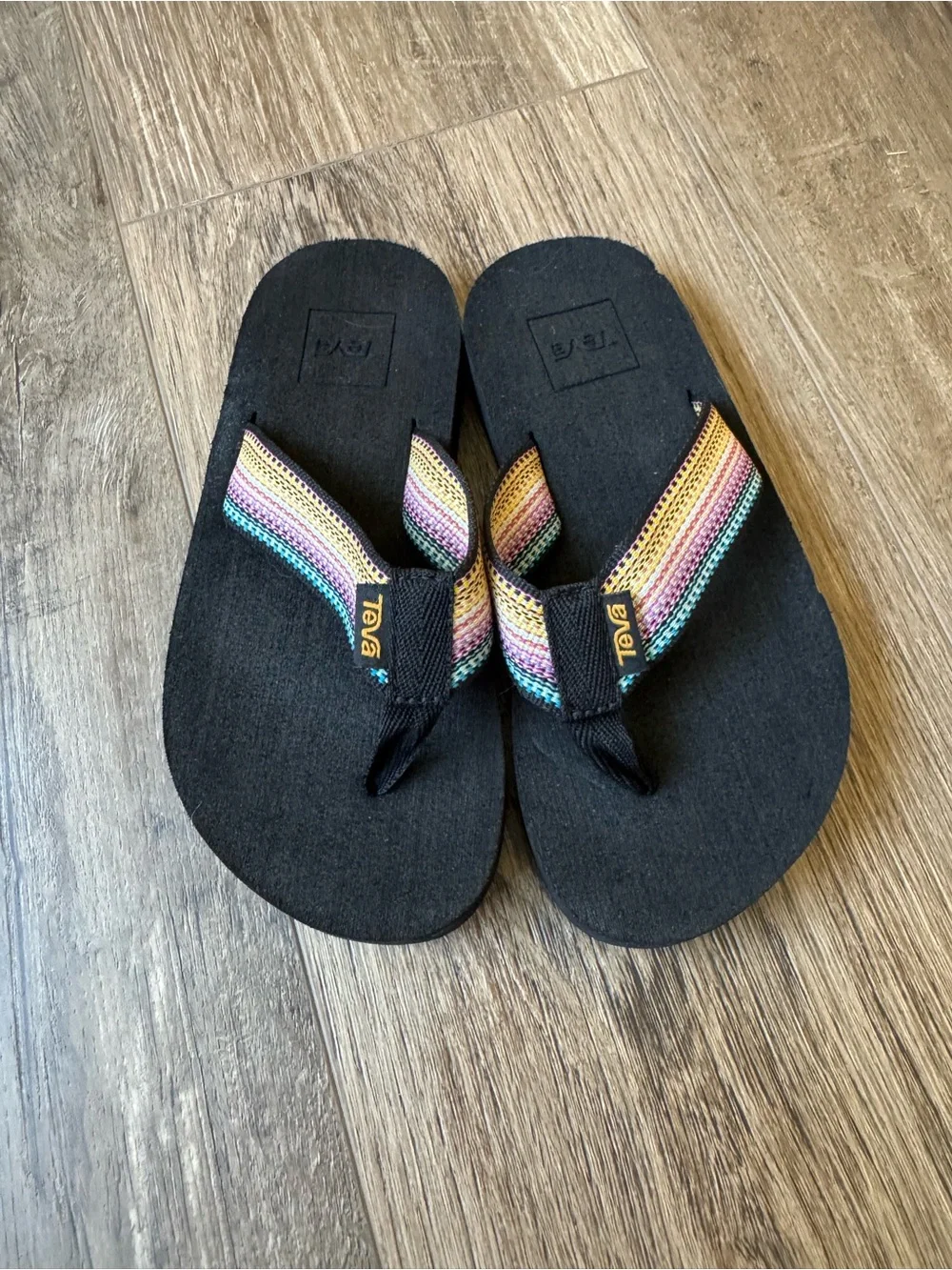 Teva Kids Black Flip Flops with Rainbow Striped Straps